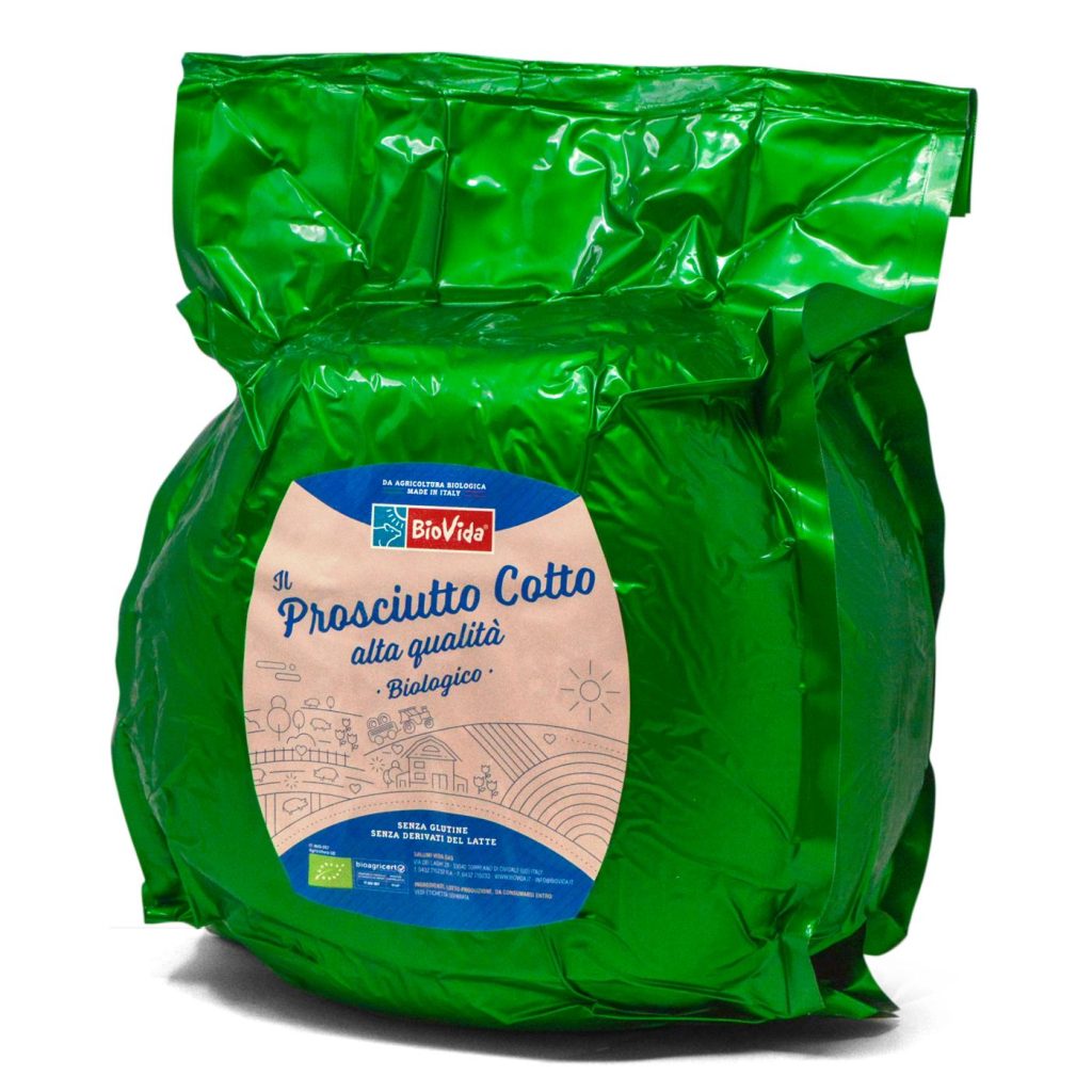 A shiny green package labeled "Prosciutto Cotto alta qualità Biologico Affettato." The circular white label features blue and red text, along with charming illustrations of a field and sun.