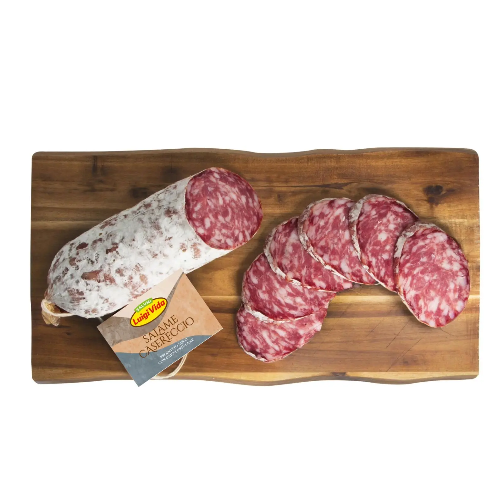 A wooden board with a whole salami and several slices arranged neatly. The salami has a white casing, and the slices reveal a marbled red and white interior. A label with text is attached to the whole salami.